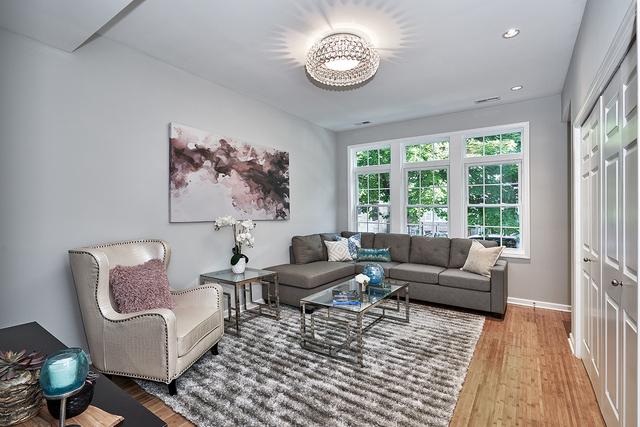 3432 West Melrose Street, Unit 2 Chicago, IL 60618 - Photo 2 of 10 a living room with furniture and a large window