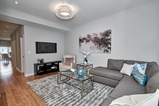 3432 West Melrose Street, Unit 2 Chicago, IL 60618 - Photo 3 of 10 a living room with furniture and a flat screen tv