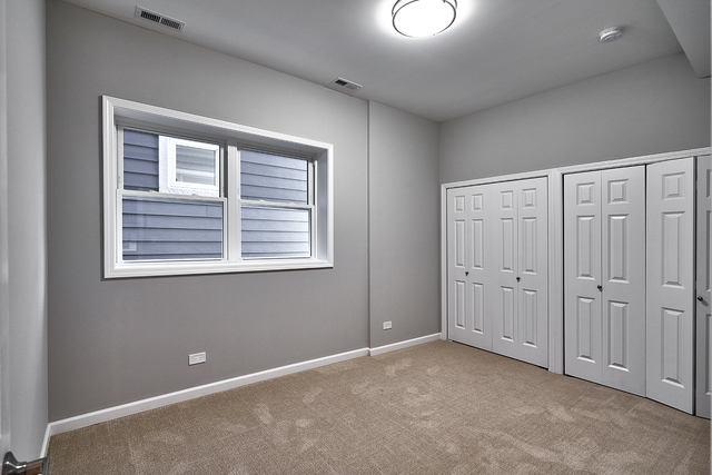 3432 West Melrose Street, Unit 2 Chicago, IL 60618 - Photo 5 of 10 a view of an empty room with a window