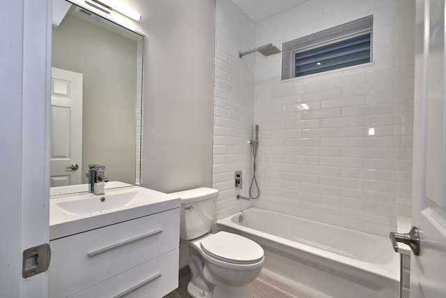 3432 West Melrose Street, Unit 2 Chicago, IL 60618 - Photo 6 of 10 a bathroom with a sink a toilet and shower