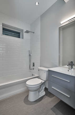 3432 West Melrose Street, Unit 2 Chicago, IL 60618 - Photo 7 of 10 a bathroom with a sink toilet and shower