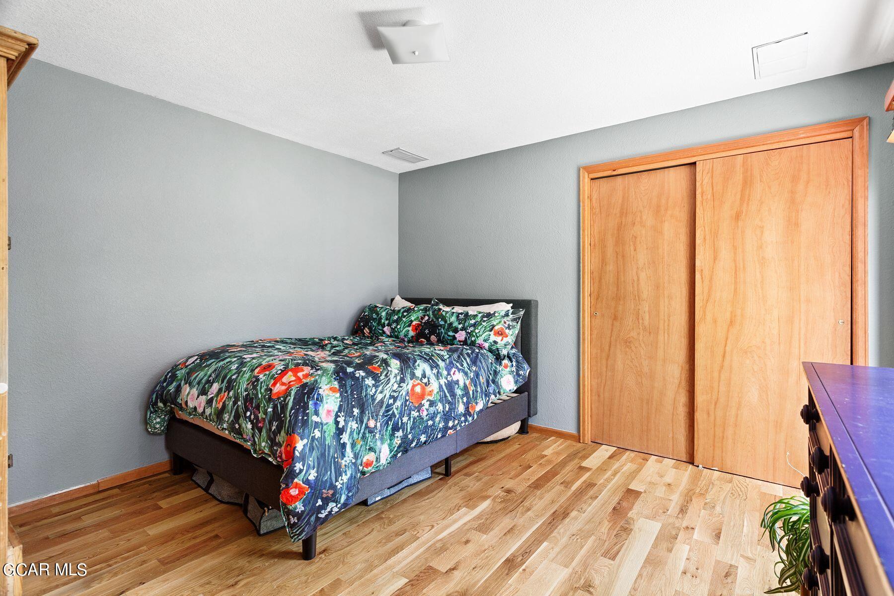 30539 Rand Road Conifer, CO 80433 - Photo 20 of 36 a bedroom with a bed and a window