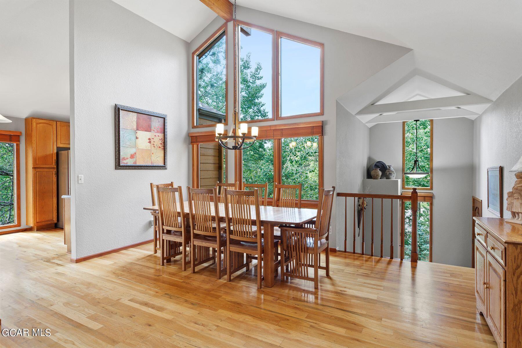 30539 Rand Road Conifer, CO 80433 - Photo 2 of 36 a view of a a dining room with furniture window and wooden floor
