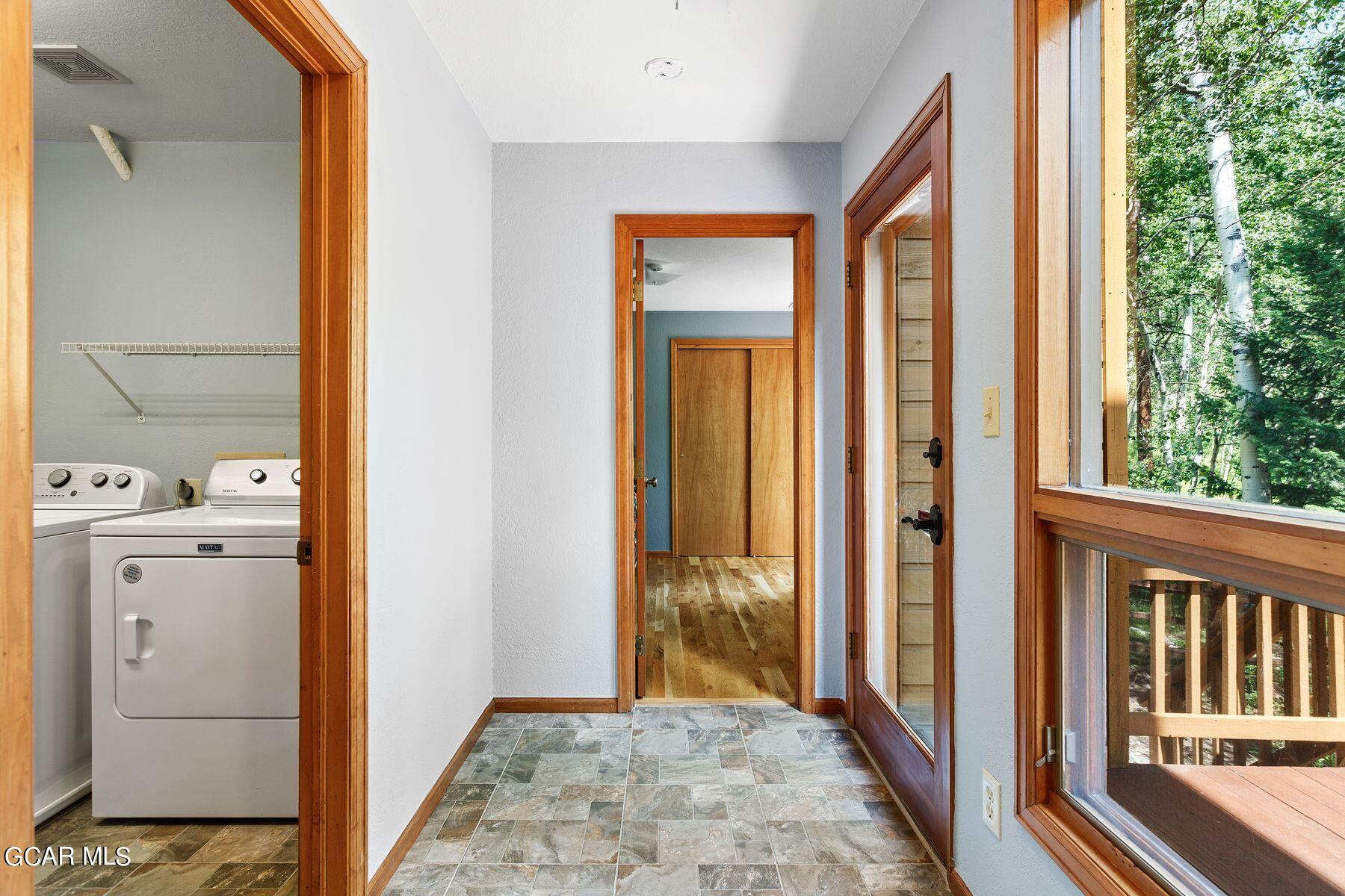 30539 Rand Road Conifer, CO 80433 - Photo 26 of 36 a view of a hallway with windows and entryway