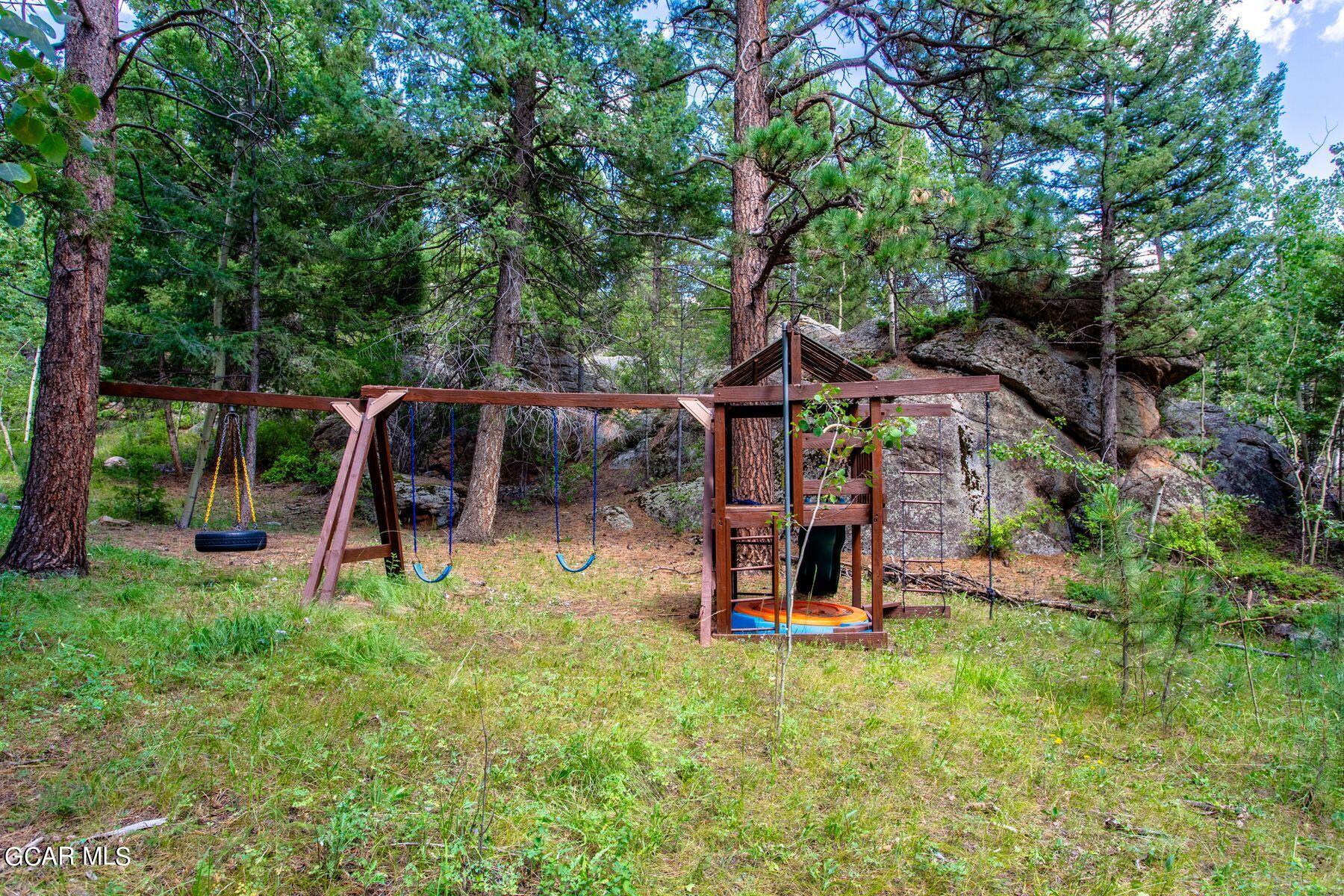 30539 Rand Road Conifer, CO 80433 - Photo 31 of 36 a view of a park with slide