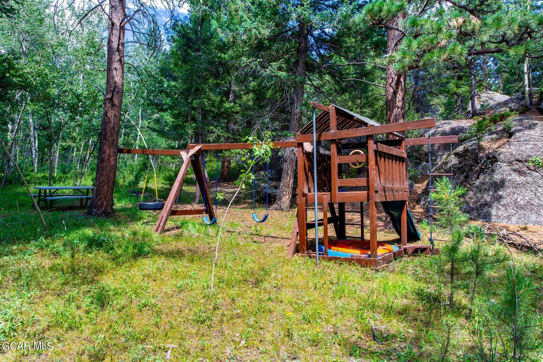 30539 Rand Road Conifer, CO 80433 - Photo 9 of 36 a view of a park with slide