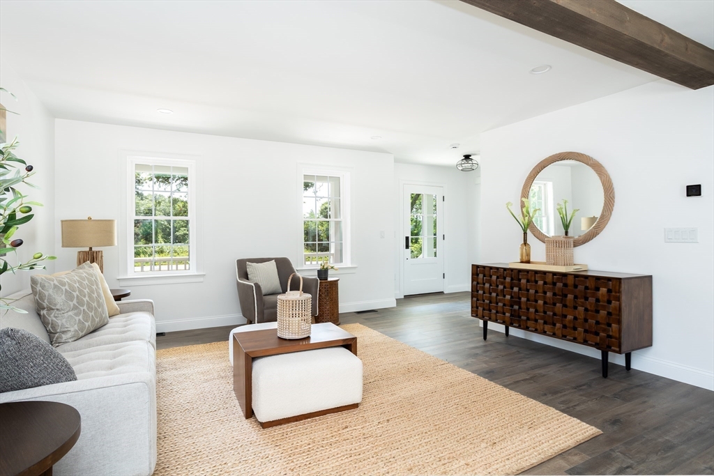 65 Great Neck Road Wareham, MA 02571 - Photo 11 of 41 a living room with furniture a window and a potted plant