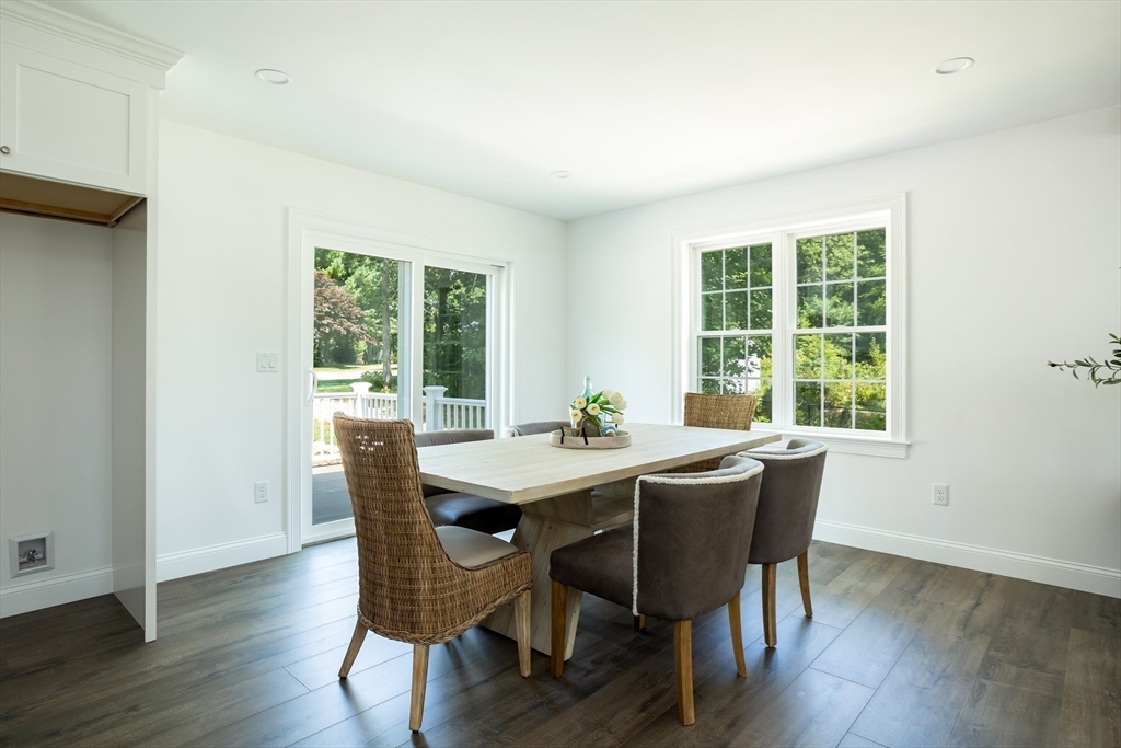 65 Great Neck Road Wareham, MA 02571 - Photo 16 of 41 a view of a dining room with a table and chairs