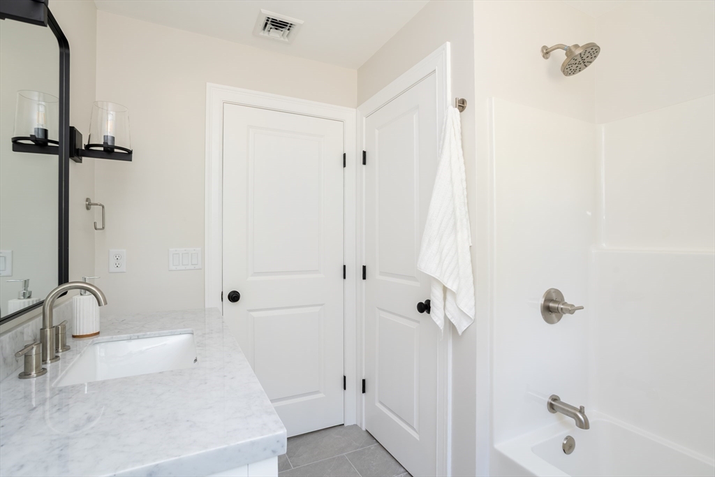 65 Great Neck Road Wareham, MA 02571 - Photo 22 of 41 a bathroom with a sink a toilet and shower