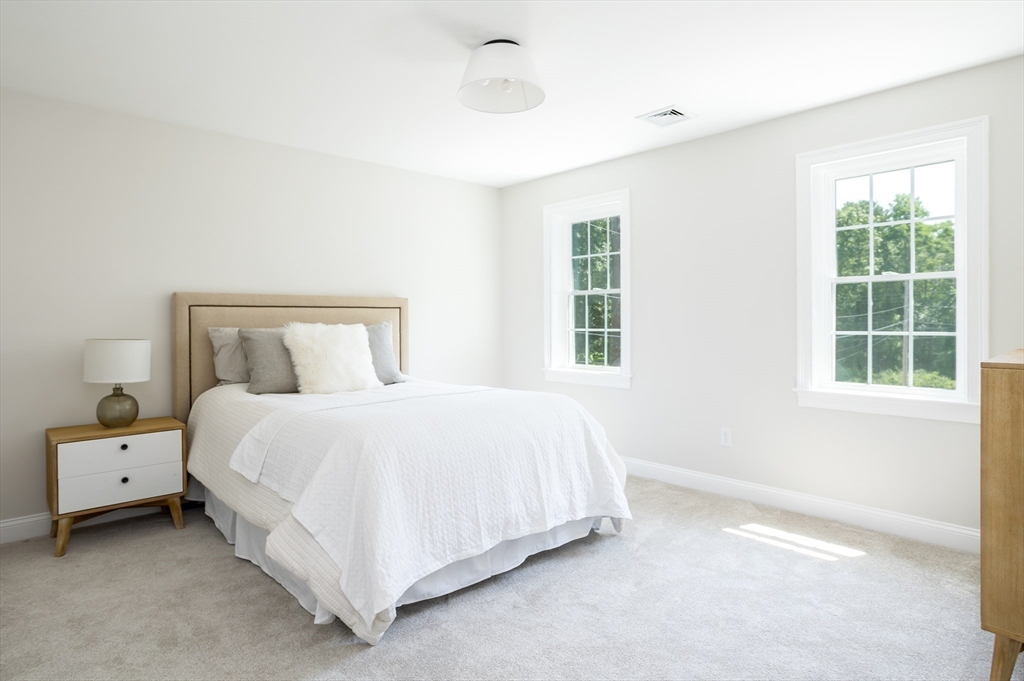 65 Great Neck Road Wareham, MA 02571 - Photo 25 of 41 a bedroom with a bed and a window