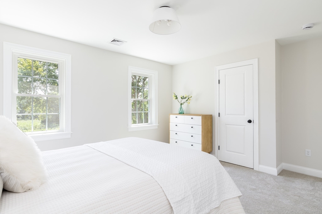 65 Great Neck Road Wareham, MA 02571 - Photo 27 of 41 a bedroom with a bed and a window