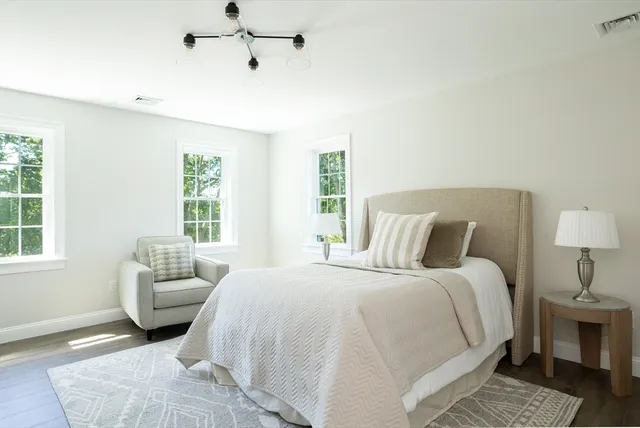 a bedroom with a large bed and a couch