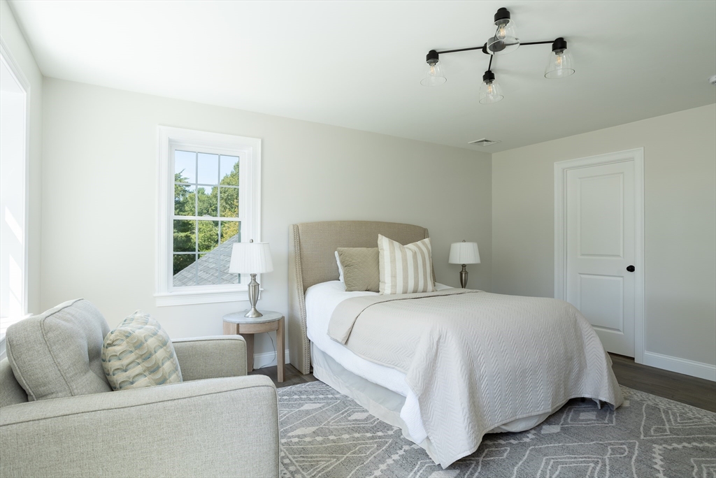 65 Great Neck Road Wareham, MA 02571 - Photo 32 of 41 a bedroom with a large bed and a couch