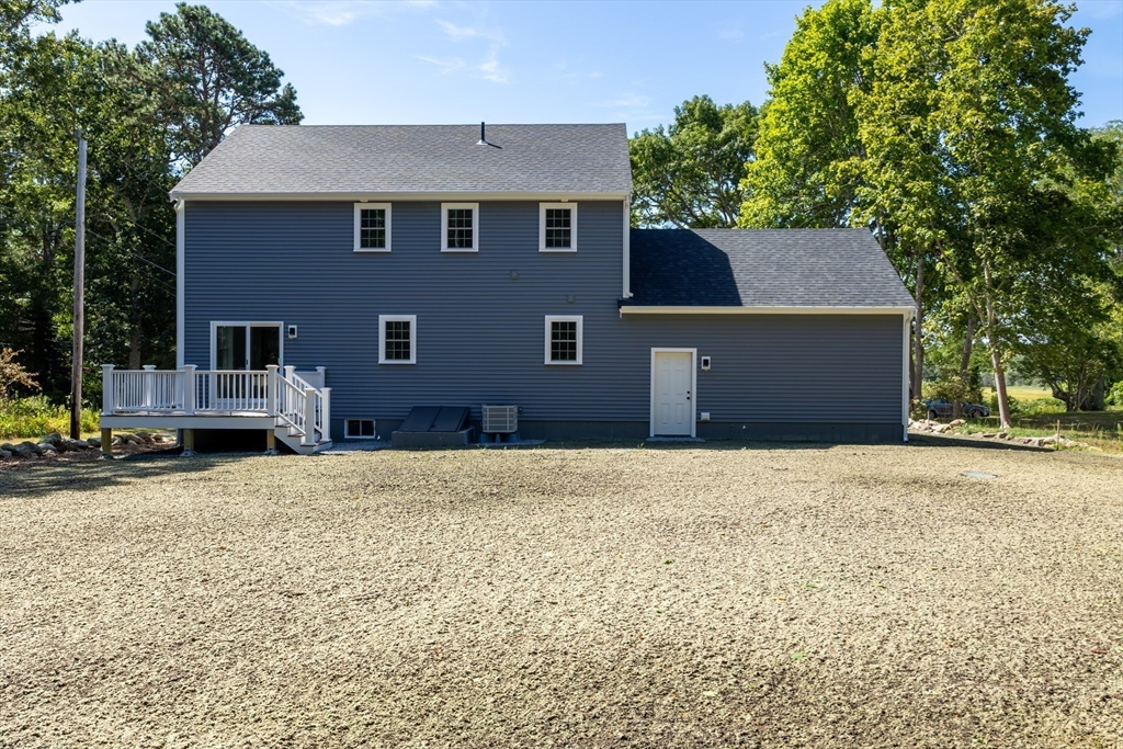 65 Great Neck Road Wareham, MA 02571 - Photo 5 of 41 a house that has a tree in front of it