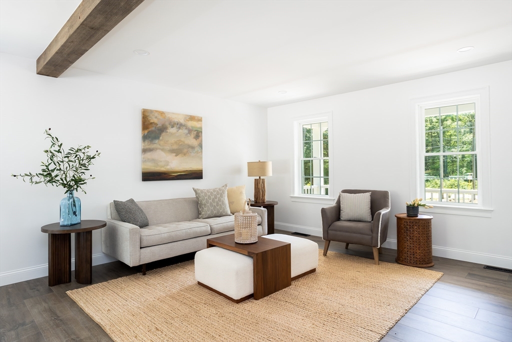 65 Great Neck Road Wareham, MA 02571 - Photo 10 of 41 a living room with furniture and a flat screen tv