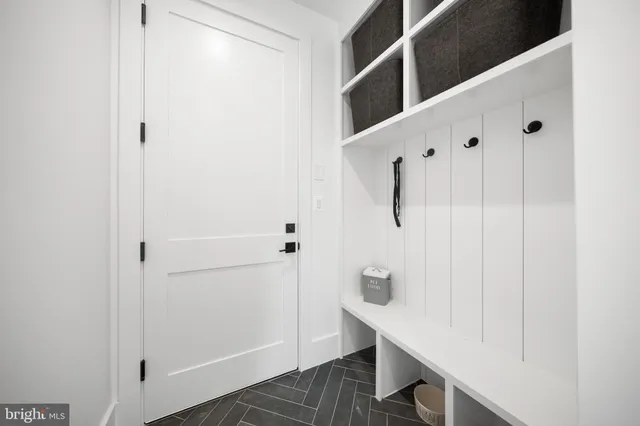 a view of balcony with wooden floor and fence