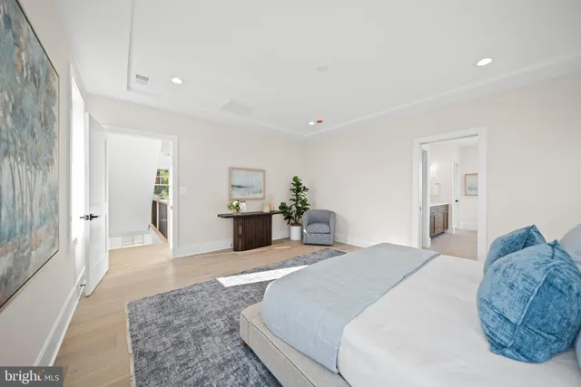 a bathroom with double vanity sinks and a mirror