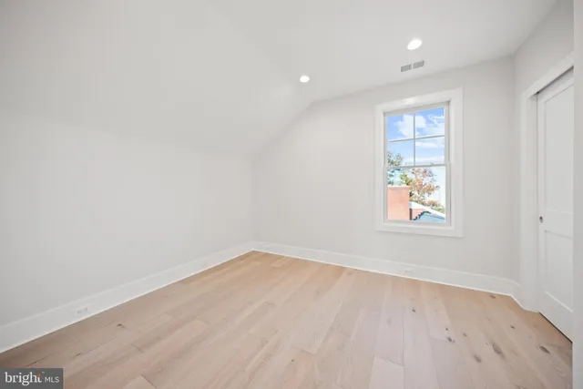 a balcony with table and chairs