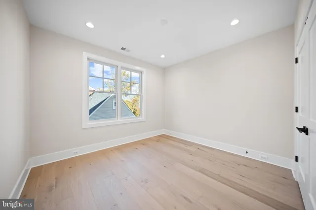 a view of yard with swimming pool and trees