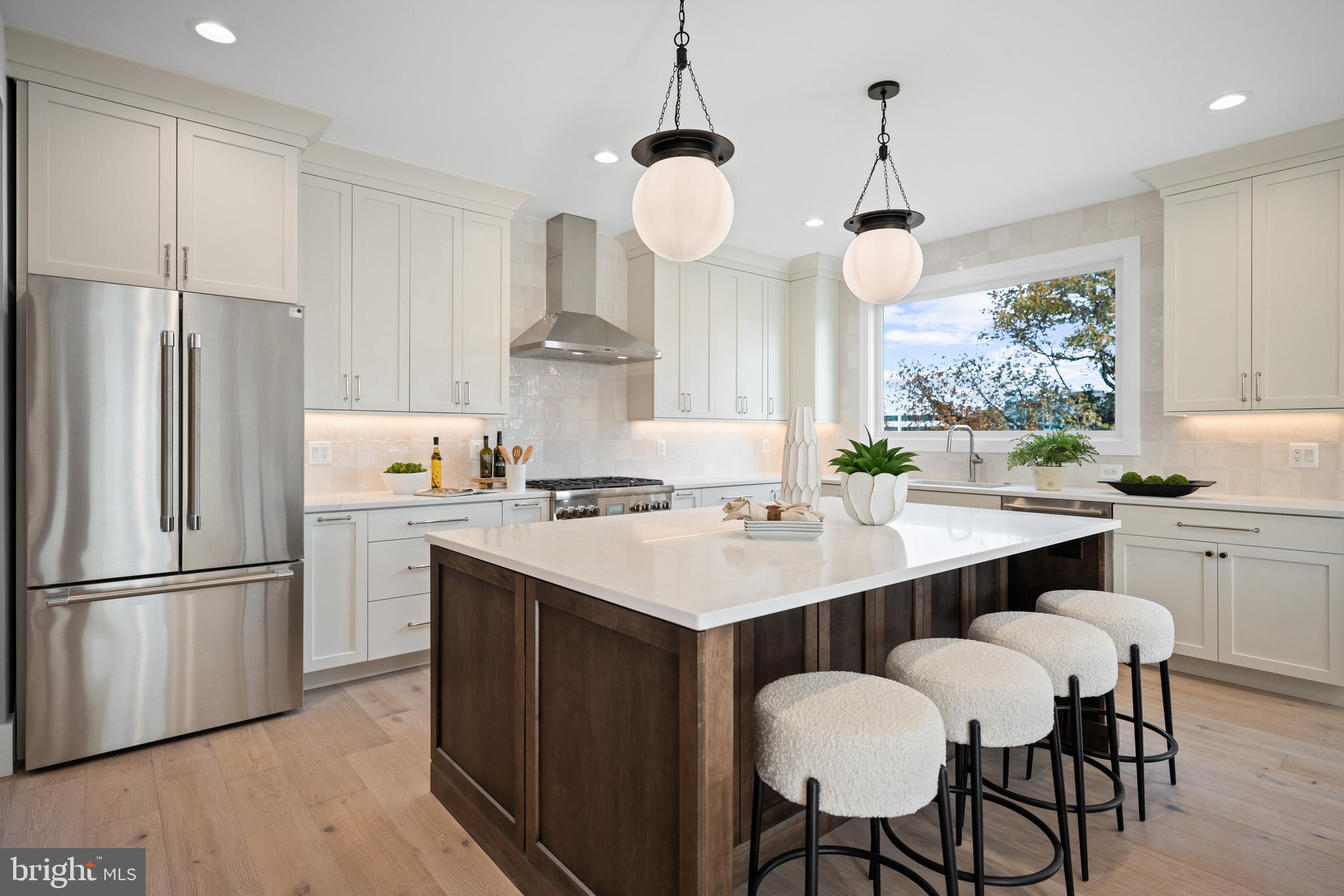 600 29th Road South Arlington, VA 22202 - Photo 8 of 62 a kitchen with a center island and a refrigerator