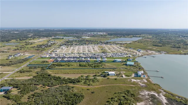 view of a lake with a yard