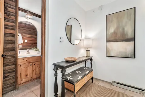 a bathroom with a mirror and a sink