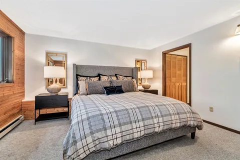 a bedroom with a bed and a couch