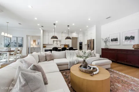 a living room with furniture fireplace and flat screen tv