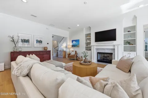 a kitchen with stainless steel appliances granite countertop a sink a stove and cabinets