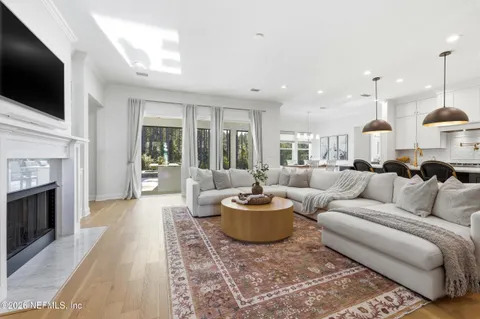 a kitchen with a counter space a sink and a chandelier