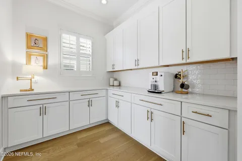 a view of walk in closet with clothes