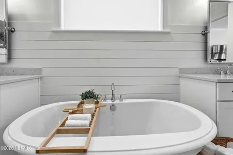 a view of walk in closet with clothes