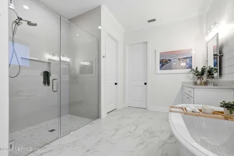 a kitchen with a table chairs and a refrigerator