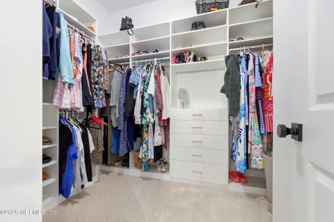 a view of living room with granite countertop furniture and a ceiling fan