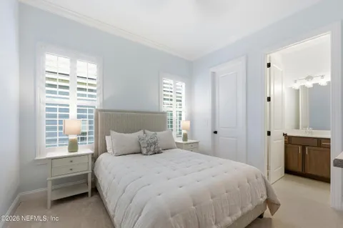 a view of river and trees in the background