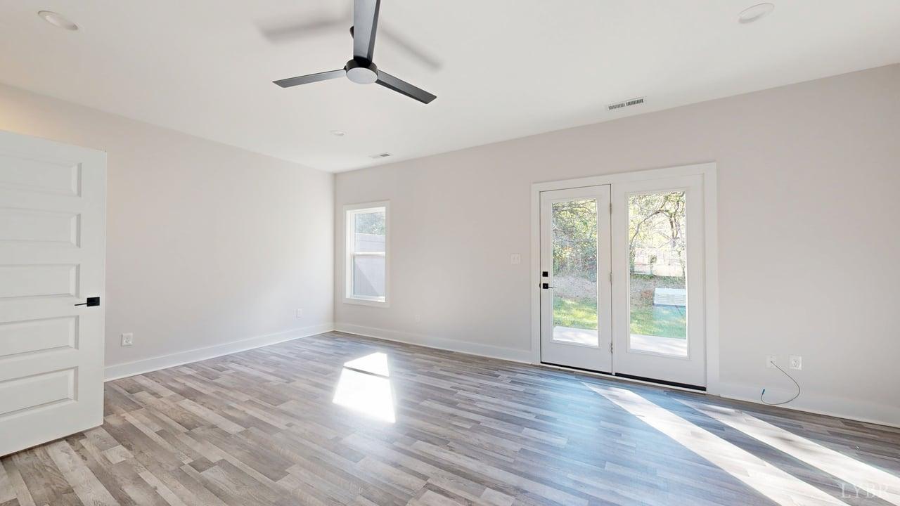 128 Allure Drive Rustburg, VA 24588 - Photo 11 of 30 wooden floor in an empty room with a window
