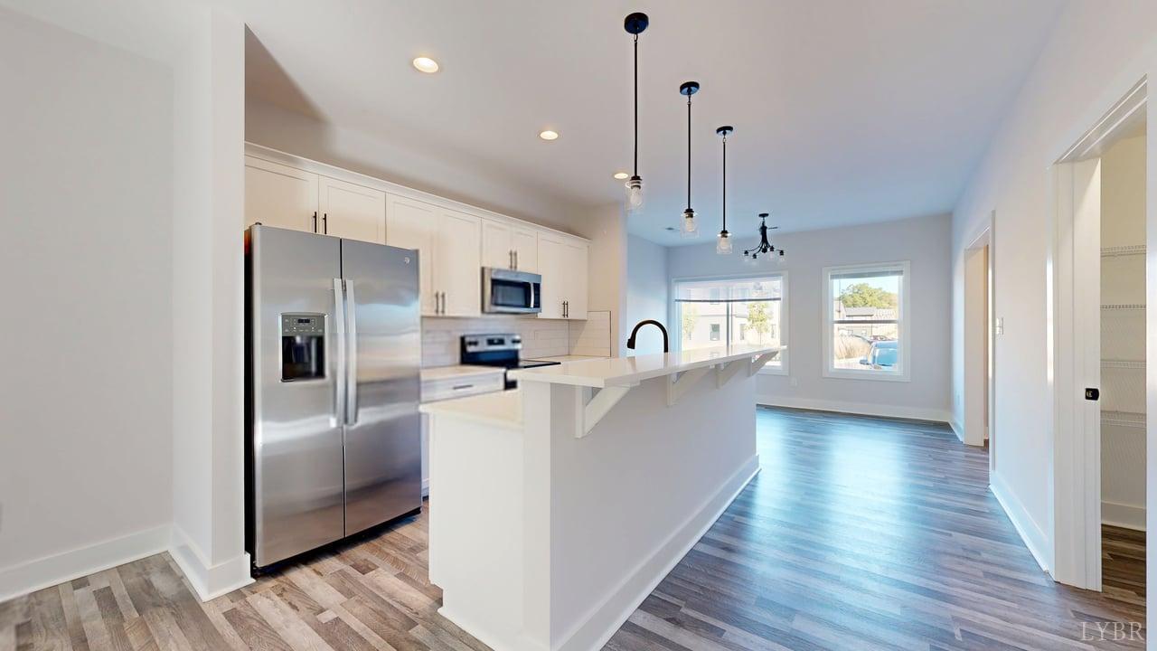 128 Allure Drive Rustburg, VA 24588 - Photo 2 of 30 a kitchen with stainless steel appliances a refrigerator sink and cabinets