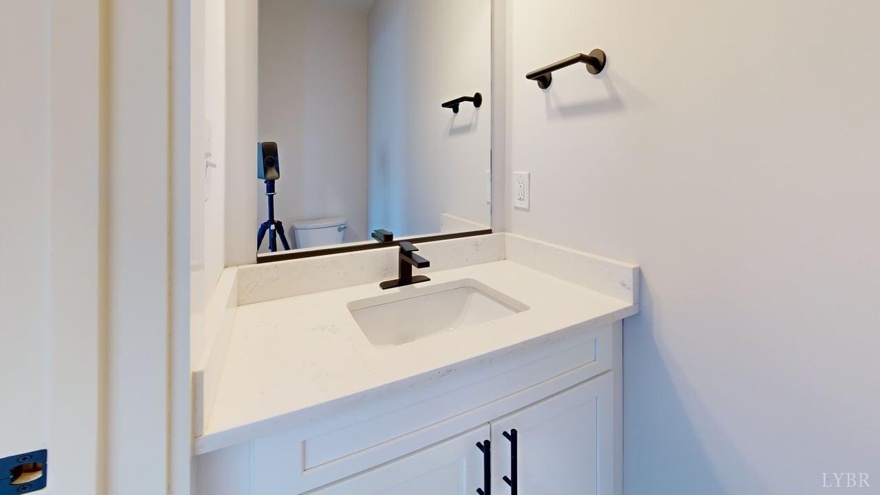 128 Allure Drive Rustburg, VA 24588 - Photo 23 of 30 a bathroom with a sink and a mirror