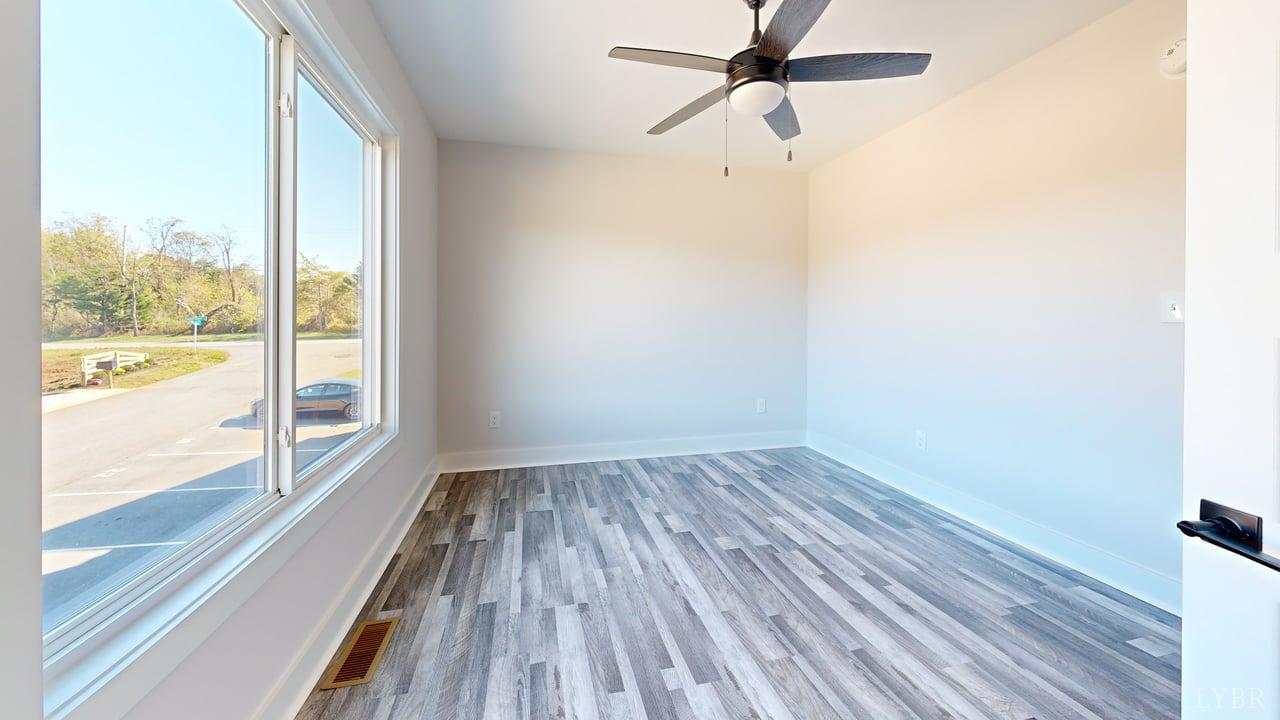128 Allure Drive Rustburg, VA 24588 - Photo 25 of 30 a view of a room with wooden floor and fan