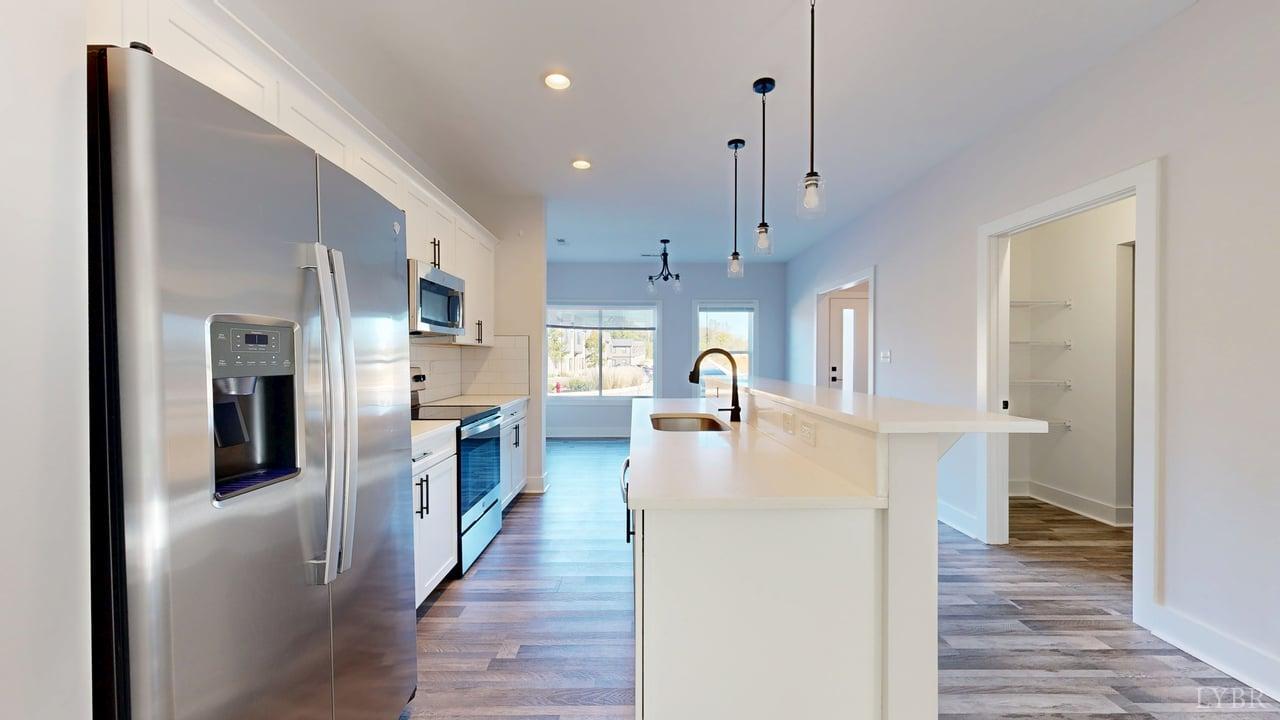 128 Allure Drive Rustburg, VA 24588 - Photo 5 of 30 a very nice looking kitchen with wooden floor and a large window