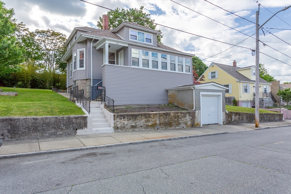 a view of a house with a street