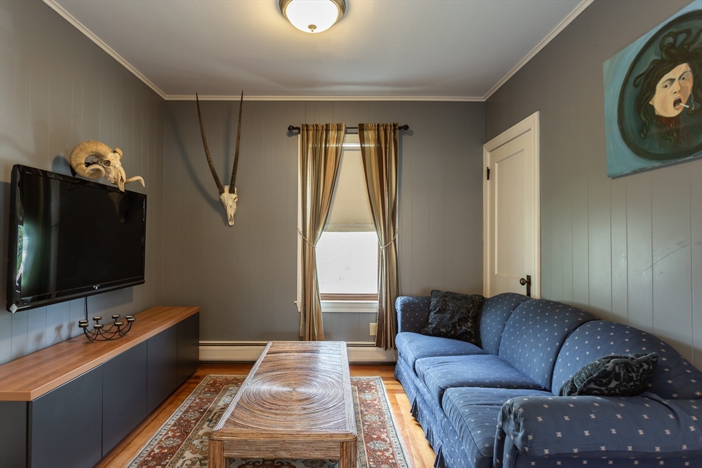 123 Huard Street Fall River, MA 02721 - Photo 14 of 26 a living room with furniture and a flat screen tv