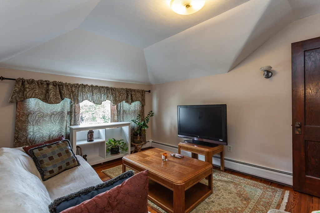 123 Huard Street Fall River, MA 02721 - Photo 20 of 26 a living room with furniture and a flat screen tv