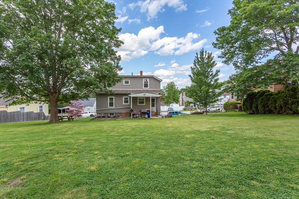 123 Huard Street Fall River, MA 02721 - Photo 24 of 26 a front view of a house with garden
