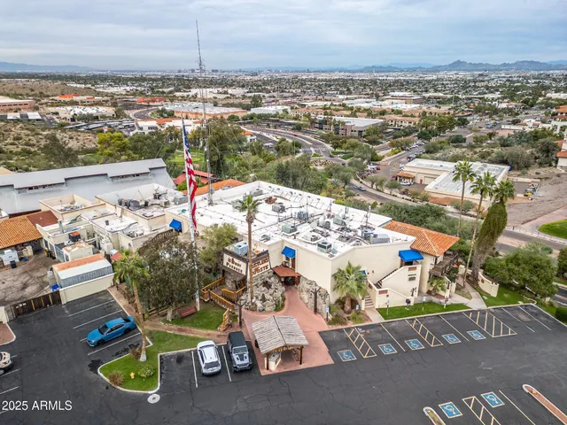 a view of a field with mountains in background