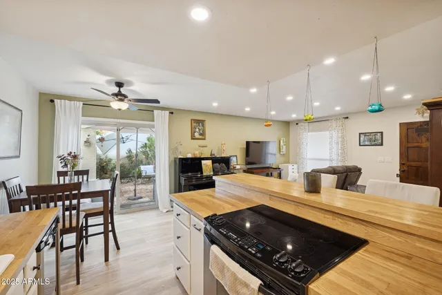 a kitchen with lots of counter top space and stainless steel appliances