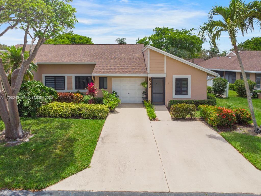 8080 Sweetbriar Way Boca Raton, FL 33496 - Photo 1 of 30 a front view of house with yard and green space