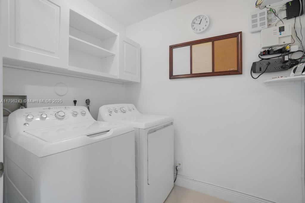8080 Sweetbriar Way Boca Raton, FL 33496 - Photo 21 of 30 a utility room with dryer and washer