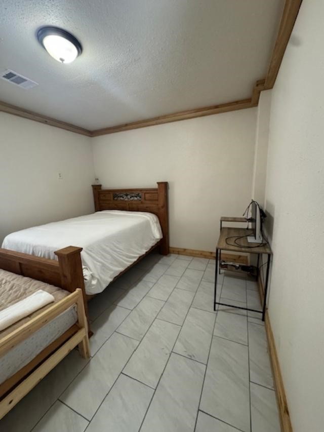 9500 Bissell Road Manvel, TX 77578 - Photo 4 of 14 a bedroom with bed and window