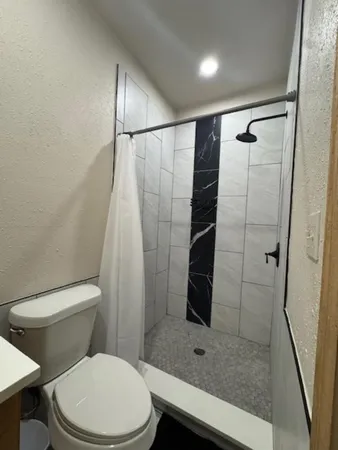 a bathroom with a toilet and a sink